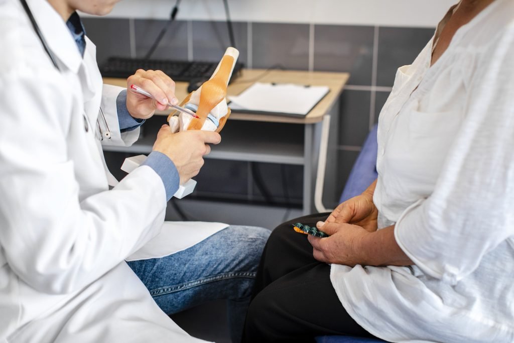 A-doctor-examines-a- woman's-arm- focusing-on- treatment-for- ACL/PCL-ligament-tear.jpg